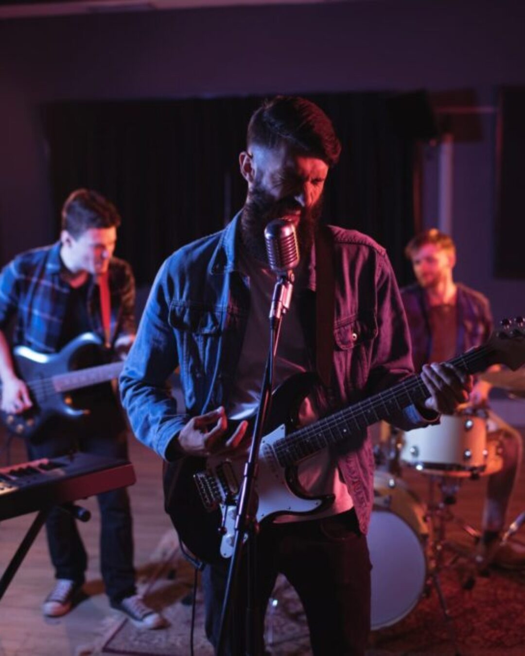 Band performing in recording studio Band performing in recording studio